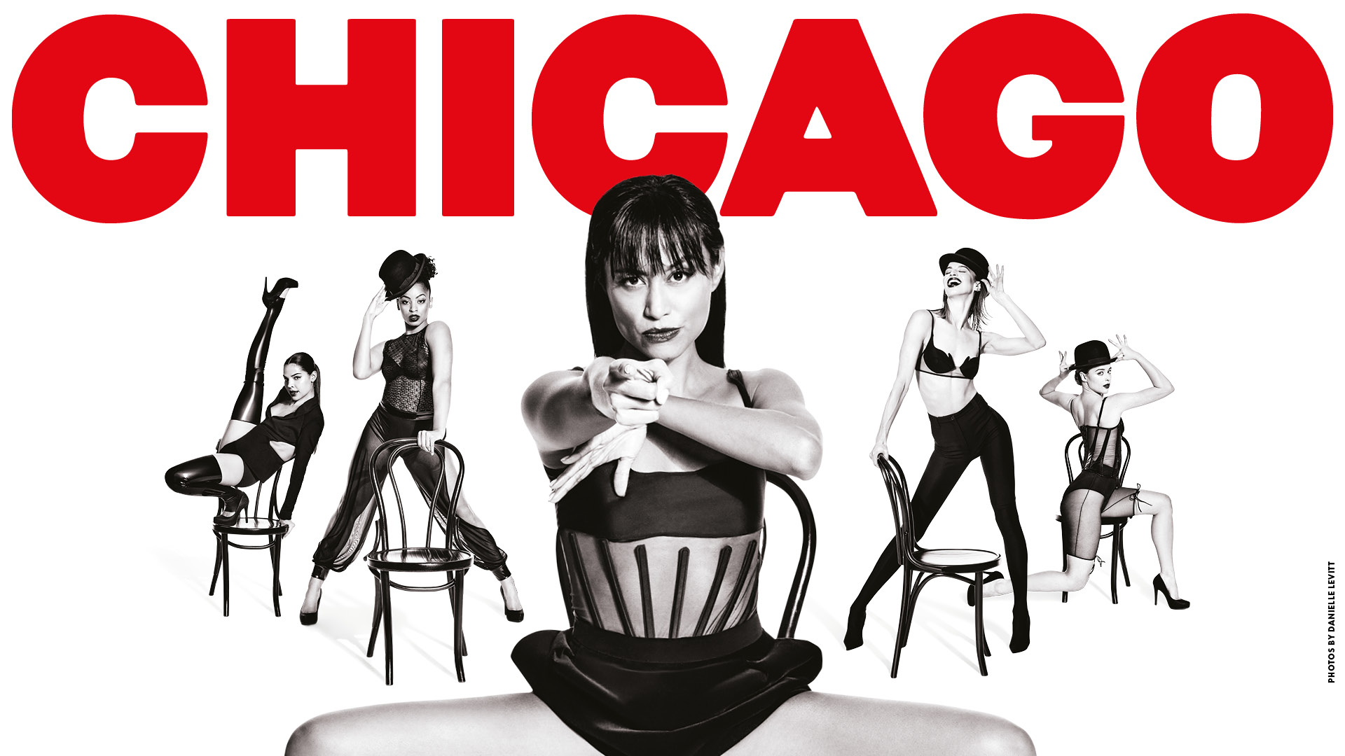 Women pose seductively in black and white image with the word CHICAGO